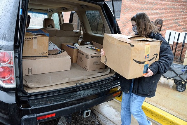 Sara Hanley, Patton Junior High School seventh-grader, loads donated food items for transport to the Leavenworth Mission Community Store/Food Pantry with the help of her mother, Melissa Hanley, after school April 28 at Patton. Sara organized a...