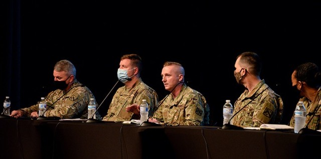 Maj. Andrew Powell, School of Advanced Military Studies student, center, tells members of the 2021 Leadership Kansas Class about his military education during an informational panel about the Army education system with fellow panelists Col....