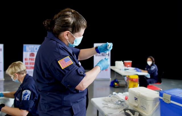 Heather Shannon, a nurse with U.S. Department of Health and
...