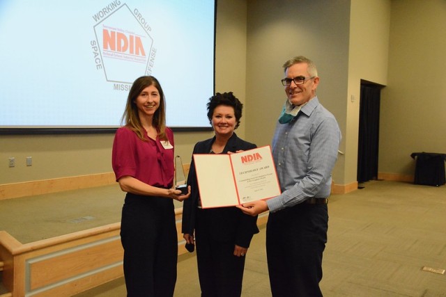 From left, Amy Turner, Patti Evans and Mark Jones accept a National Defense Industrial Association Technology Award as members of the Army Materiel Command’s Commanding General’s Initiatives Group Graphics Team. The award was presented during...