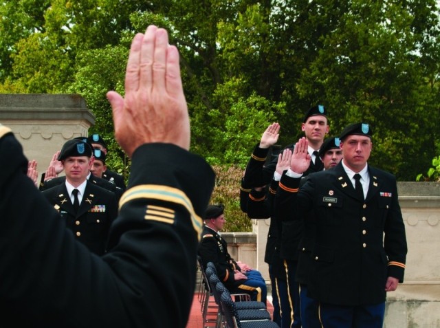 Army Col. Haldane Lamberton, commander of the 238th Regimental Training Institute, swears in new officer candidates during their graduation ceremony at the state capitol in Frankfort, Ky., Sept. 27, 2015.