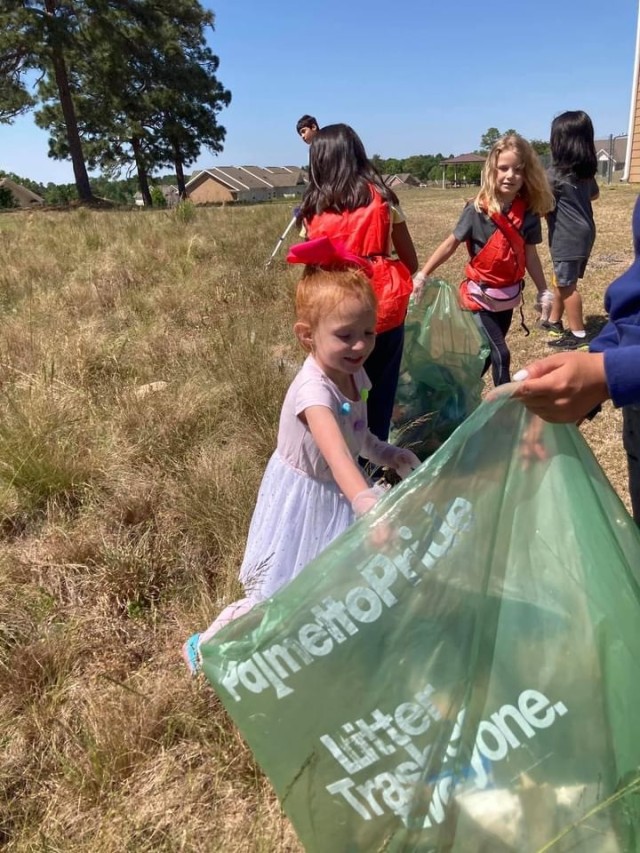 Youths in the Fort Jackson housing area pick up trash as part of Fort Jackson&#39;s Earth Day.