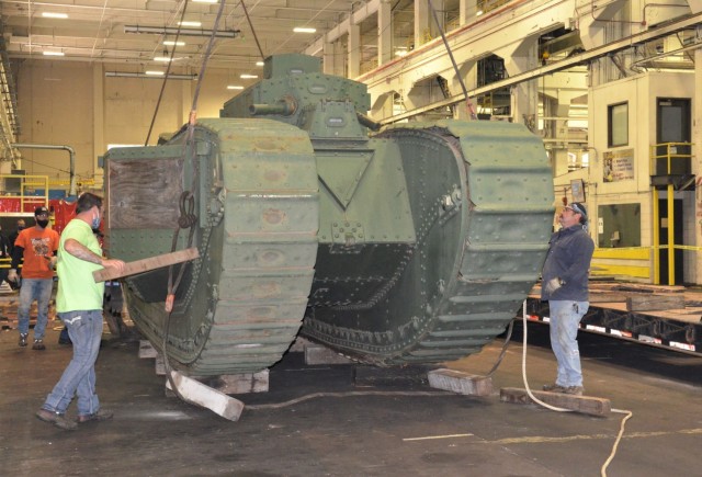 Once inside the facility at the Rock Island Arsenal – Joint Manufacturing and Technology Center, the unloading team assesses The Liberty Mark VIII tank. – Photo by Staci-Jill Burnley, Army Sustainment Command