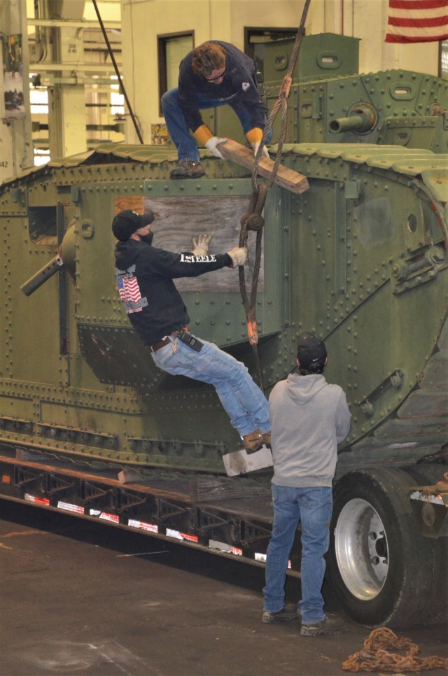 Once inside the facility at the Rock Island Arsenal – Joint Manufacturing and Technology Center, the unloading team assesses The Liberty Mark VIII tank. – Photo by Staci-Jill Burnley, Army Sustainment Command