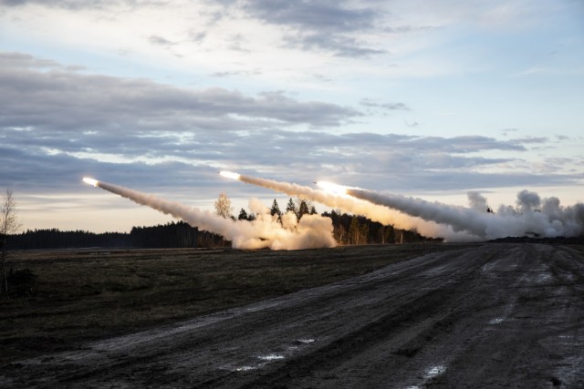 TAPA CENTRAL TRAINING AREA, Estonia – U.S. Army Soldiers from B Battery, 1st Battalion, 77th Field Artillery Regiment, 41st Field Artillery Brigade, and United Kingdom soldiers from the Royal Horse Artillery conduct a Multiple Launch Rocket System live fire exercise here on May 5, 2021. This live fire exercise was the kick-off event for Fires Shock, a series of exercises designed to enhance readiness and interoperability by providing credible, long-range precision fires at any given time. This portion of Fires Shock was in support of Swift Response 21, a linked exercise of DEFENDER-Europe 21. DEFENDER-Europe 21 is a large-scale U.S. Army-led exercise designed to build readiness and interoperability between the U.S., NATO allies and partner militaries. This year, more than 28,000 multinational forces from 26 nations will conduct nearly simultaneous operations across more than 30 training areas in more than a dozen countries from the Baltics to the strategically important Balkans and Black Sea Region. Follow the latest news and information about DEFENDER-Europe 21, visit www.EuropeAfrica.army.mil/DefenderEurope.