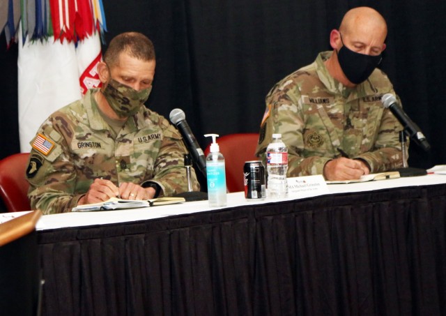 Sergeant Major of the Army Michael Grinston (left) and Command Sgt. Maj. Michael Williams (left), senior enlisted adviser of the 1st Armored Division, take notes at a town hall meeting during his visit on Fort Bliss, Texas, May 11, 2021. The visit was an opportunity to listen to service members and their spouses to identify any issues in order to find a suitable solution. During the visit, Grinston engaged with students of the Noncommissioned Officer Leadership Center of Excellence; held a military spouse quality of life town hall; held a local media engagement to discuss quality of life initiatives to support Soldiers; conducted a garrison walk-through, and discussion with Soldiers. (U.S. Army photo by Staff Sgt. John Onuoha, 5th Armored Brigade)