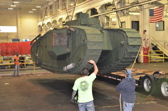 Once inside the facility at the Rock Island Arsenal – Joint Manufacturing and Technology Center, the unloading team assesses The Liberty Mark VIII tank. – Photo by Staci-Jill Burnley, Army Sustainment Command