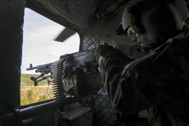 3rd Combat Aviation Brigade Command Sgt. Maj. Jason Huff scans for targets during aerial gunnery at Fort Stewart, Georgia, Apr. 27. Aerial gunnery allows Soldiers to train on their weapon systems to maintain the brigade’s combat readiness. (U.S....