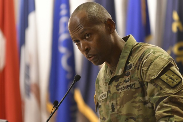 Command Sgt. Maj. Terrence T. Scarborough speaks before audience members during the Transportation Corps Relinquishment of Command and Responsibility Ceremony May 6 at Wylie Hall's Washburn Auditorium. Scarborough, the 14th Trans. Corps CSM, is...