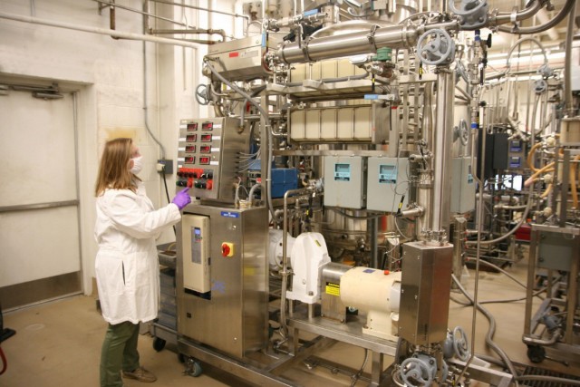Dr. Anna Crumbley, a research chemical engineer, removes the solids from a new batch of fermented micro-organisms. The Chemical Biological Center is currently able to produce 1,000-liter batches of biomanufactured material at its Aberdeen Proving...