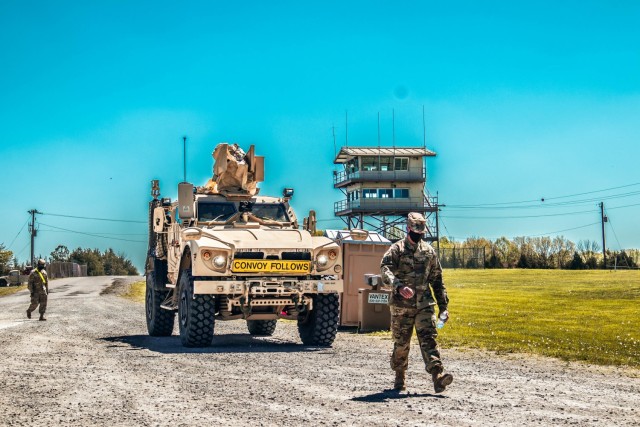 Sgt. 1st Class Shannon Lincoln guiding in the Battalion Commander’s, Lt. Col. Shelia Day, vehicle for the 129th Combat Sustainment Support Battalion, 101st Division Sustainment Brigade, at Fort Knox, Ky. May 2, 2021.