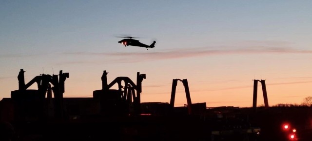 The Aviation Soldiers conduct aerial security as the sun sets over Camp Atterbury, Ind., as 129th Combat Sustainment Support Battalion, 101st Division Sustainment Brigade, closes out operations for GR21.
