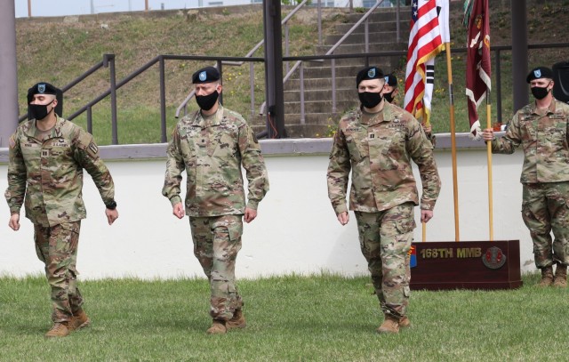 On April 23, 2021 on the Camp Humphreys Parade Field, Capt. Louis Rivas handed the unit guidon to Capt. Clayton Bender as the ‘Paladins’ of the 568th Medical Ground Ambulance Company watched on. Above from left to right are Rivas, outgoing commander, Lt. Col. Charles Douglas, commander of the 168th Multifunctional Medical Battalion, and Bender. This change of command became unique in that it was the first time the company came together despite social distancing guidelines.