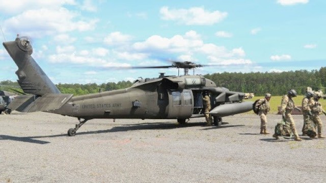 A group of U.S. Army Soldiers assigned to 3rd Combat Aviation Brigade, 3rd Infantry Division, exit a UH-60L Black Hawk helicopter after performing a successful aerial gunnery exercise on Fort Stewart, Georgia, April 27, 2021. Aerial gunneries...