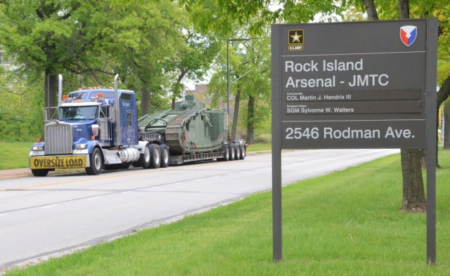 The historic Liberty Mark VIII tank, manufactured at Rock Island Arsenal 101 years ago in support of World War I, makes it way home through the streets of Moline, Illinois. The tank is only one of three left in existence. – Photo by Staci-Jill...