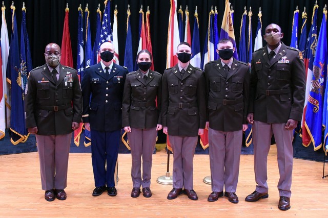 Command Sgt. Maj. Finis A. Dodson, U.S. Army Space and Missile Defense Command command sergeant major, left, and Maj. RaShaun D. Warren, University of North Alabama ROTC battalion department chair, right, pose with the battalion’s newly...