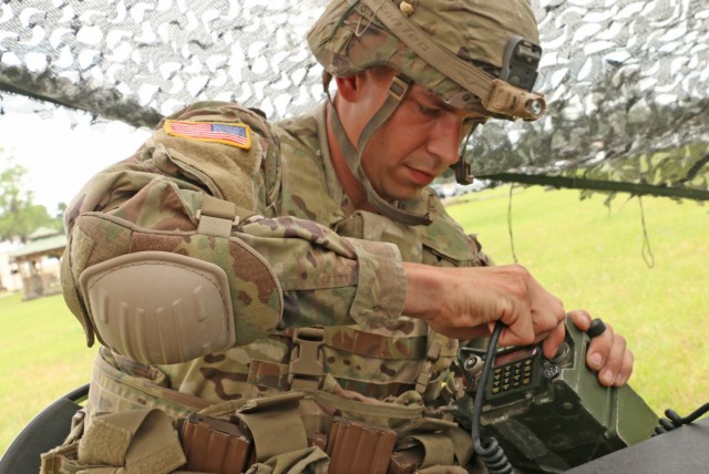 U.S. Army Spc. Travis Fisher, a motor transport operator assigned to 1st Battalion, 28th Infantry Regiment, 3rd Infantry Division, demonstrates his tactical communications skills during the Division’s Soldier and Noncommissioned Officer of the Year Competition on Fort Stewart, Georgia, May 5, 2021. Candidates tested their tactical knowledge as part of the warrior skills lanes. Candidates must outperform all other competitors in both physical and mental toughness as well as technical and tactical knowledge and proficiency to proceed through the corps, major command, and ultimately the Army level competitions. (U.S. Army photo by Staff Sgt. Todd Pouliot)