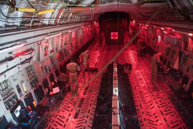 Airmen of the 446th Airlift Wing prepare their equipment during Exercise Nexus Dawn at Travis Air Force Base, California, on April 27, 2021. Through exercises like Nexus Dawn, Reserve Citizen Airmen hone their readiness and effectiveness so they...