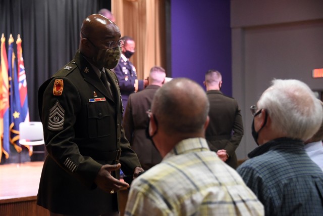 Command Sgt. Maj. Finis A. Dodson, U.S. Army Space and Missile Defense Command command sergeant major, speaks with family members before a commissioning ceremony for the University of North Alabama’s ROTC battalion, May 7. (U.S. Army photo by...