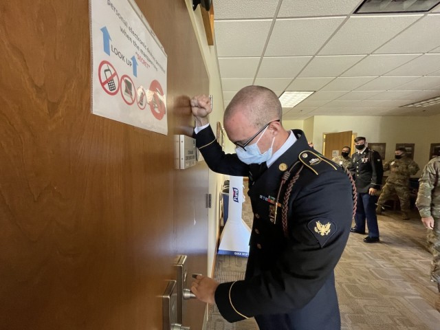 Spc. Gavin Currey, a cavalry scout assigned to 6th Squadron, 8th Cavalry Regiment, 2nd Armored Brigade Combat Team, 3rd Infantry Division, knocks on the door to the Division Soldier and Noncommissioned Officer of the Year Competition board at Fort Stewart, Georgia, May 7, 2021. The 3rd ID Soldier and Noncommissioned Officer of the Year Competition board tests the candidates' technical and tactical knowledge, as well as confidence and mental toughness. (U.S. Army photo by Spc. Jose Escamilla)