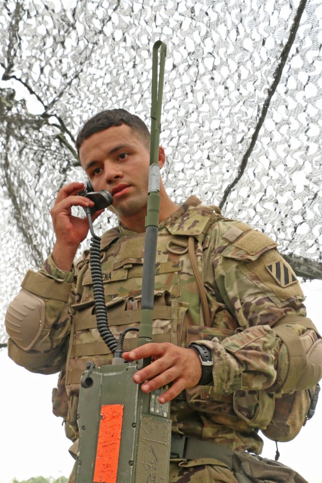 U.S. Army Pfc. Luis Peña, an infantryman assigned to 3rd Battalion, 15th Infantry Regiment, 2nd Armored Brigade Combat Team, 3rd Infantry Division, demonstrates his tactical communication skills during the Division’s Soldier and Noncommissioned Officer of the Year Competition on Fort Stewart, Georgia, May 5, 2021. Candidates tested their tactical knowledge as part of the warrior skills lanes. Candidates must outperform all other competitors in both physical and mental toughness as well as technical and tactical knowledge and proficiency to proceed through the corps, major command, and ultimately the Army level competitions. (U.S. Army photo by Staff Sgt. Todd Pouliot)