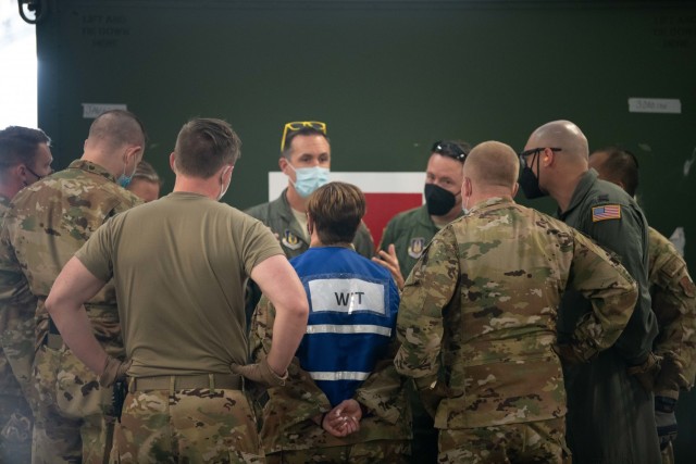 Senior Master Sgt. Christine Palmer, 349th Aeromedical Evacuation Squadron, briefs Exercise Nexus Dawn participants prior to an aeromedical evacuation evaluation scenario on April 27, 2021 at Travis Air Force Base, California. (U.S. Air Force...