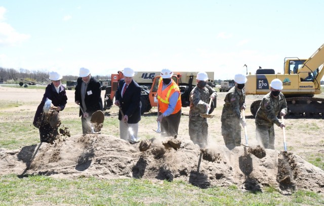 Participating in a ground-breaking ceremony May 12 for a new unmanned aircraft system (UAS) hangar at Wheeler-Sack Army Airfield were Pam Favre, Fort Drum Public Works master planner; Dave McNeil, QPK Design engineer of record; Bill Halsey,...
