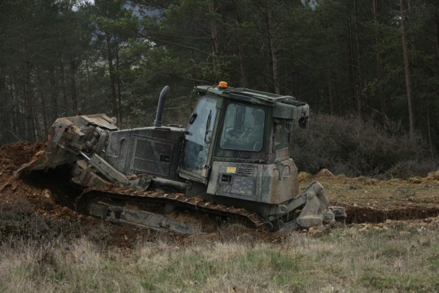 A U.S. Army Soldier assigned to the 2nd Cavalry Regiment creates an antitank berm during Dragoon Ready 21 at the Hohenfels Training Area, April 15, 2021. Daily training, conducted in realistic environments, under realistic circumstances, ensures our forces maintain the highest levels of proficiency and readiness for worldwide deployment. (U.S. Army photo by Spc. Zachary Bouvier)