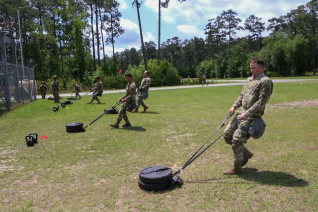 U.S. Army Soldiers perform the sprint, drag, carry event of the Army Combat Fitness Test as part of a stress shoot exercise at Small Arms Range Delta during the Division’s Soldier and Noncommissioned Officer of the Year Competition on Fort Stewart, Georgia, May 4, 2021. The stress shoot tested the Soldiers’ ability to fire accurately in spite of being physically stressed. Candidates must outperform all other competitors in both physical and mental toughness as well as technical and tactical knowledge and proficiency to proceed through the corps, major command, and ultimately the Army level competitions. (U.S. Army photo by Sgt. Trenton Lowery)