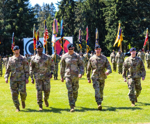 The incoming and outgoing 7th Infantry Division command teams led by America's First Corps commander Lt. Gen. Randy George at the change of command and responsibility ceremony at JBLM, May 11, 2021. (From Left to Right) Outgoing command team:...