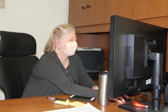 Babe Fain, Sierra Army Depot training assistant, manages employee training records from her workstation, May 12 at Sierra Army Depot in Herlong, California. Fain, 75, has been a Department of the Army civilian for 32 years.