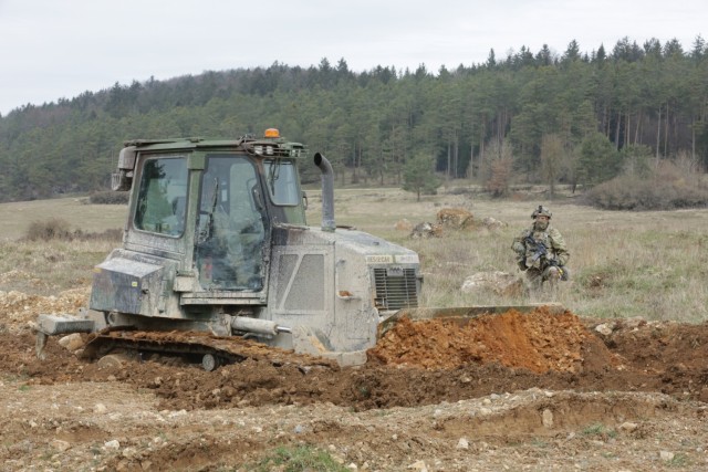 A U.S. Army Soldier assigned to the 2nd Cavalry Regiment creates an antitank berm during Dragoon Ready 21 at the Hohenfels Training Area, April 15, 2021. Daily training, conducted in realistic environments, under realistic circumstances, ensures our forces maintain the highest levels of proficiency and readiness for worldwide deployment. (U.S. Army photo by Spc. Zachary Bouvier)