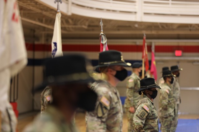 Capt. Neisha Bailey, the 602nd Maintenance Company commander, stands with other 553rd Division Sustainment Support Battalion company commanders and guidons during a conversion ceremony April 16 at Fort Hood. The 602nd was redesignated as B Company during the ceremony.