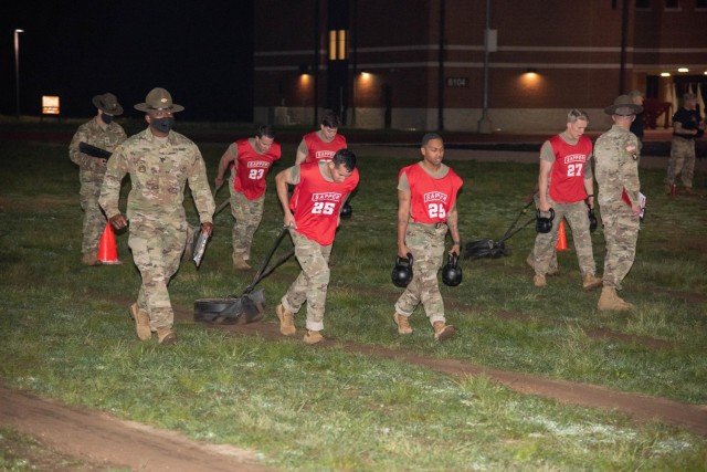 1st Lt. Ralpael Eirea and Staff Sgt. Johnny Gray assigned to 9th Engineer Battalion, 2nd Armored Brigade Combat Team, 3rd Infantry Division, participate in a non standard army physical fitness test apart of the Best Sapper Competition on Fort...