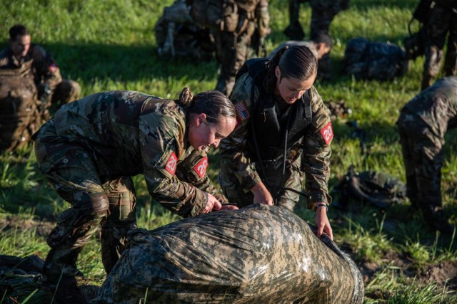 1st Lt. Trisha Burden(right) and 2nd Lt. Amanda Atkinson(left) assigned to 9th Engineer Battalion, 2nd Armored Brigade Combat Team, 3rd Infantry Division, participate in a Poncho Raft Swim apart of the Best Sapper Competition on Fort Leonard Wood,...