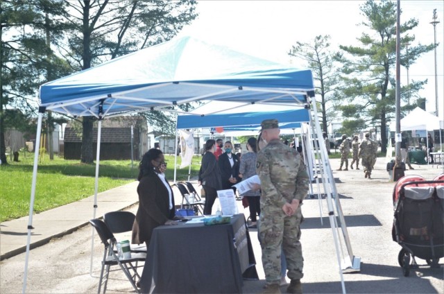 Screaming Eagle Soldiers and Army spouses speak to potential employers May 6 during the Open Air Hiring Fair at the Spouse Employment Center.