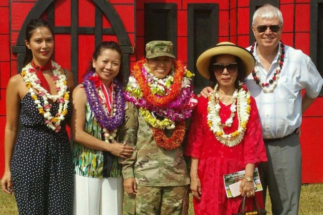 Army Col. Danielle Ngo, center, is surrounded by family members after relinquishing command of the 130th Engineer Brigade at Schofield Barracks, Hawaii, July 10, 2018. From left to right are Ngo’s sisters, Stefanie Smolski and Lan-Dinh Ngo; Ngo; Ngo’s mother, Thai-An Ngo Smolski; and Ngo’s stepfather, John Smolski.