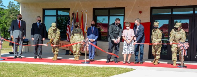 Maj. Gen. David Wilson, former Chief of Ordnance, and Ann Jarrett MacDonald, daughter of Col. George “Burling” Jarrett, cut the ribbon dedicating the Ordnance Training Support Facility during a ceremony May 14, 2021. The event took place on the 209th birthday of the Army Ordnance Corps.