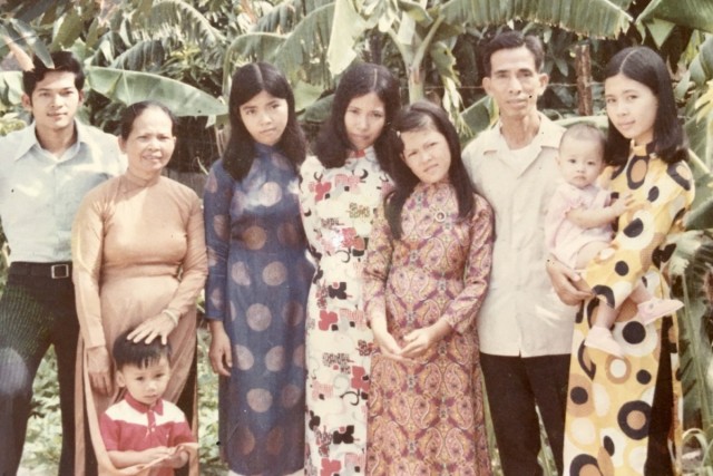 During the Vietnam War, relatives of Danielle Ngo pose for a photo in the early 1970s in South Vietnam. Ngo is being held by her aunt, Tuong Van, on the far right.