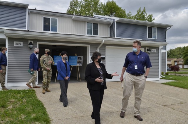 Karsten Haake, Lendlease project director for the Campbell Crossing community, gives Brenda Lee McCullough, director, U.S. Army Installation Management Command Directorate-Readiness, a tour of the New Hammond Heights community May 5.