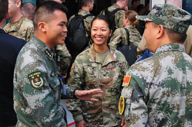 U.S. Army Col. Danielle Ngo, then the commander of the 130th Engineer Brigade at Schofield Barracks, Hawaii, shares a laugh with members of the Chinese army while on break during the U.S.-China Disaster Management Exchange&#39;s Expert Academic...