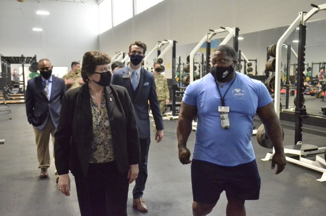 Brenda Lee McCullough, director, U.S. Army Installation Management Command Directorate-eadiness, tours the recently renovated Olive Physical Fitness Center May 4 during a visit to Fort Campbell.