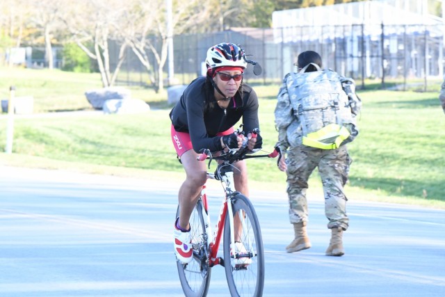 More than a dozen community members gathered at Magrath Sports Complex for a sprint triathlon, hosted by Fort Drum Family and Morale, Welfare and Recreation (FMWR). The staff designed the event to allow participants the option to either use a spin bike or ride their own road bike on a 12-mile course outside. This was one of many activities planned this month at Fort Drum in support of the Army Strong B.A.N.D.S. (Strong Balance, Activity, Nutrition, Determination and Strength) campaign. (Photo by Mike Strasser, Fort Drum Garrison Public Affairs)