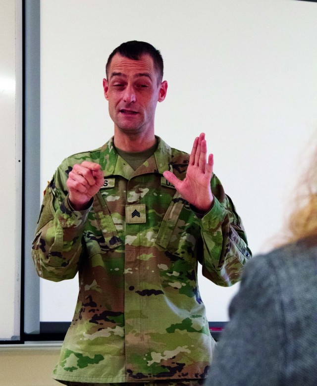 Michigan Guard Soldier helps at vaccination events with sign language