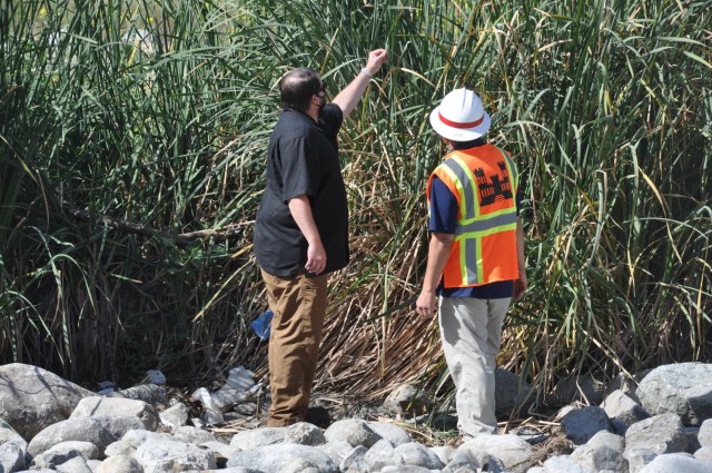 Project manager Trevor Spencer points out bird nesting area in the riverbed reeds to lead biologist Jon L. Rishi, May 4, 2021, in Glendale, California. The Corps manages projects along 226,000 square miles of Southern California, Arizona and...
