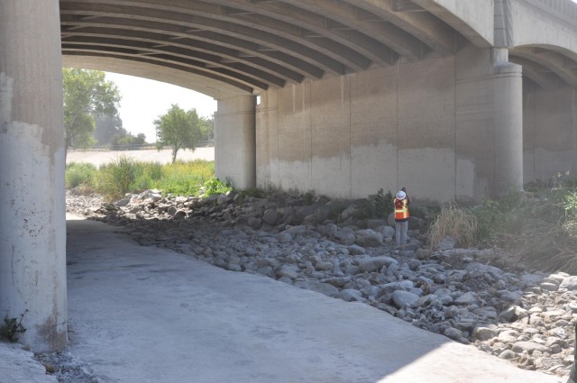 District biologist Jon Rishi checks for nesting birds and other wildlife, May 4, under a bridge between Glendale and Los Angeles, California.