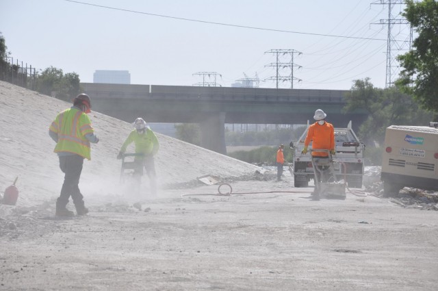 Construction workers prepare a work road, May 4, 2021 along the bed of the Los Angeles River as part of an Army Corps of Engineers Los Angeles District project. The Corps manages projects along 226,000 square miles of Southern California, Arizona...