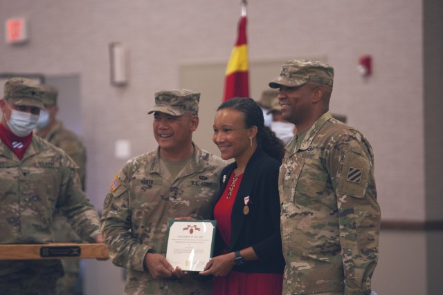 Maj. Gen. Antonio Aguto, commanding general of the 3rd Infantry Division, recognizes Alicia Francis during a change of command ceremony May 13, 2021, at Fort Stewart’s Club Stewart, for all her hard work and energy she put into the 3rd ID...