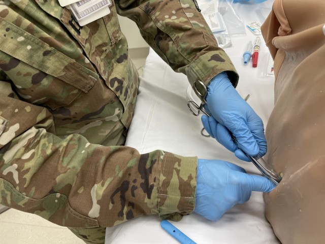 Martin Army Community Hospital's ER Physician Capt. Jacob Arnold inserts a chest tube, during Brooke Army Medical Center's FCCS/ICTL Course.