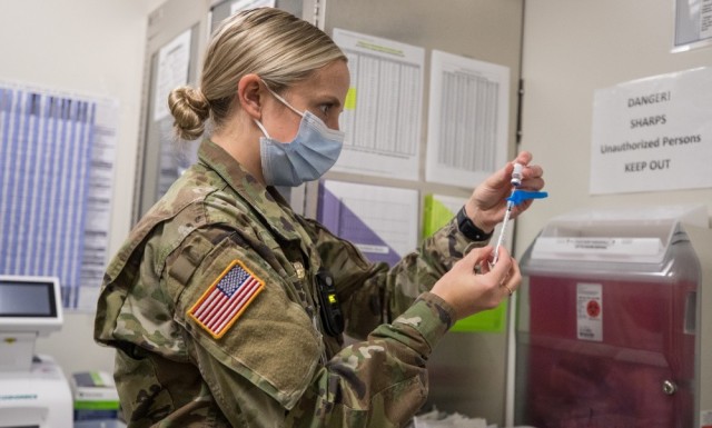 Capt. Patricia Nolan prepares vaccinations of the Pfizer-BioNTech COVID-19 vaccine on Dec. 16, 2020, at Madigan Army Medical Center on Joint Base Lewis-McChord, Wash. The Army announced on May 12 that it had administered more than 1 million COVID-19 vaccines worldwide.